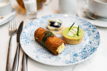 Top view of savory finger foods at afternoon tea