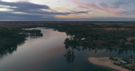 Aerial Dusk view of Mina de Sao Domingos, Tapada Grande River Beach lagoon, famous tourist destination, Alentejo, Portugal.