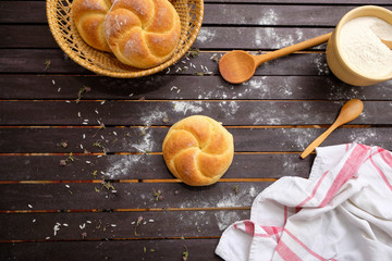 Kaiser rolls top view on a wooden table