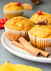 Sweet pumpkin or carrot muffins with fall spices. Autumn dessert. Healthy baking concept. Copy space.
