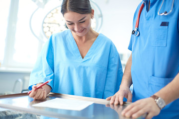 The girl, who wants to correct sagging breasts, at the receptio