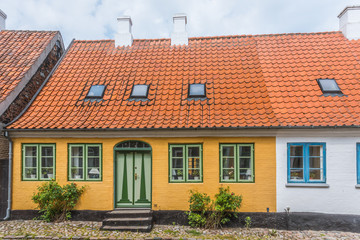 Fototapeta na wymiar the facade of an old idyllic house in a cobbled street, island of Aero, Denmark,