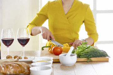 Smiling young couple cooking food in the kitchen