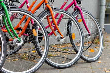 Naklejka premium Front wheels of three colorful bicycles
