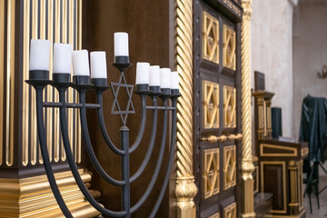 Fototapeta na wymiar Synagogue inside interior, close up on big candles