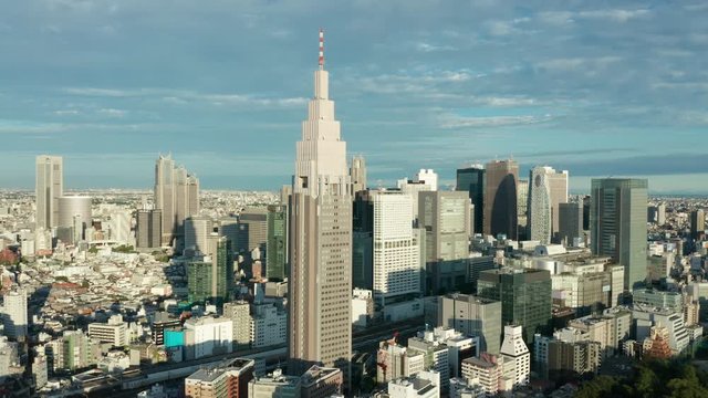 day flying past DTT Docomo Yoyogi building towards Shinjuku Tokyo