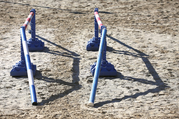 Various colorful obstacles for equestrian training