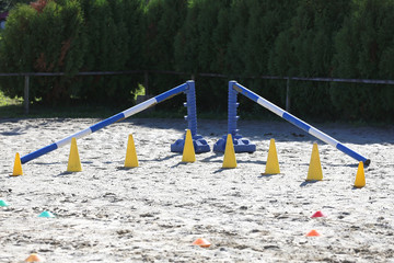 Various colorful obstacles for equestrian training