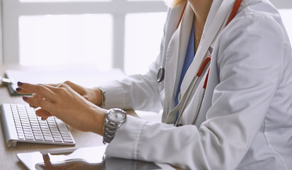 young woman doctor takes patient in office