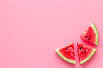 Fresh watermelon on pink background top view copyspace