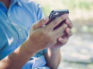 Man hand holding smartphone