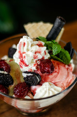 raspberry and pistachio ice cream sundae dessert in bowl