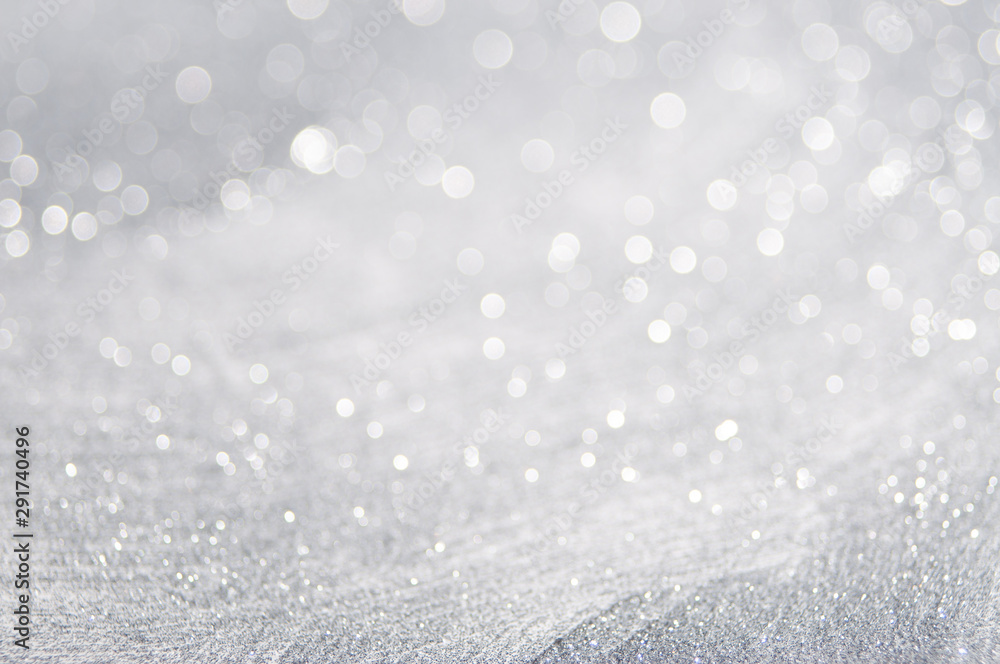 Wall mural abstract of bright and sparkling bokeh background. silver and diamond dust bokeh blurred lighting fr