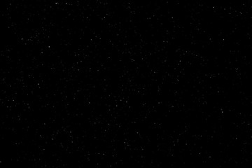 Chaotic white bokeh on a black background, light spots texture, abstraction, falling snow, starry sky, bright glare of light texture