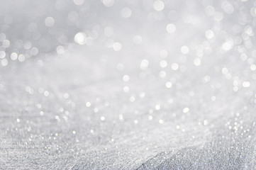 Abstract of Bright and sparkling bokeh background. silver and diamond dust bokeh blurred lighting...