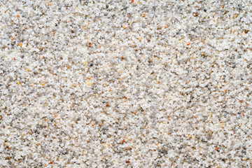 Natural colored marble chips background texture. Decorative marble plaster for indoor and outdoor use. Coarse-grained stone. quartz sand