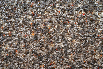 Natural colored marble chips background texture. Decorative marble plaster for indoor and outdoor use. Coarse-grained stone. quartz sand