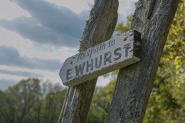 Footpath sign in kent walking across the fields