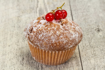 Sweet tasty muffin with red currants