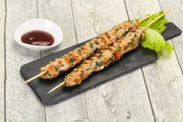 Minced pork skewer kebab with sauce