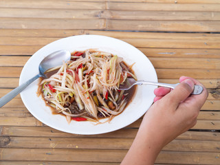 Eating Thaifood papaya salad