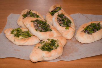 Homemade meat pie on wooden table close-up with, rustic style