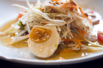 Thai spicy green papaya salad with salted egg