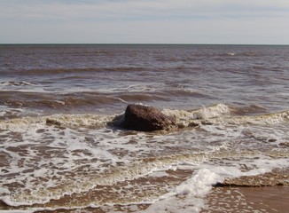 A rock in the surf