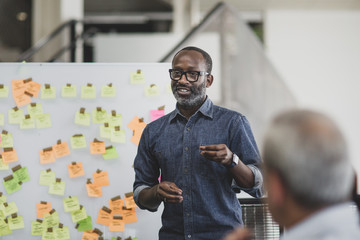 African American executive holding a brainstorm meeting