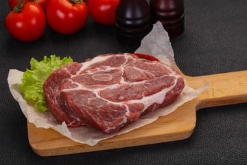 Raw pork neck steak