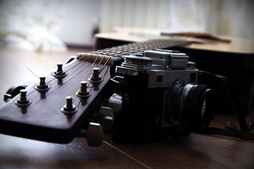 vintage film camera with classic acoustic guitar 