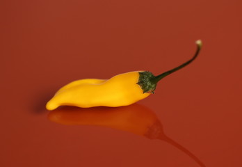 Yellow chili pepper on a table