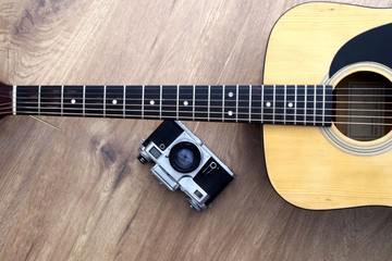 vintage film camera with classic acoustic guitar 