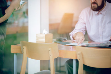 Businessmen think and choose food menu