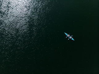A drone shooting a kayak floating in the water. © Stanislav