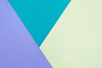 Abstract background and texture. Three sheets of multi-colored lilac, turquoise and light yellow paper...