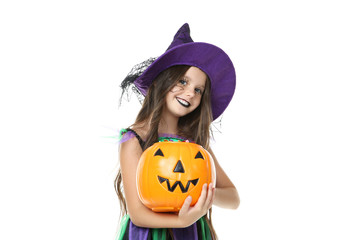 Beautiful girl in halloween costume with pumpkin bucket on white background