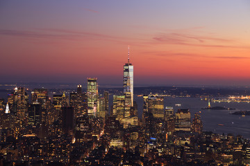 Fototapeta na wymiar Aerial view of New York City skyline illuminated at sunset, USA