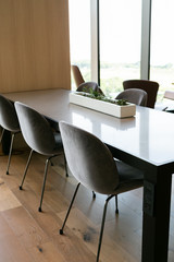 Succulents in white long planter on table, modern office decor
