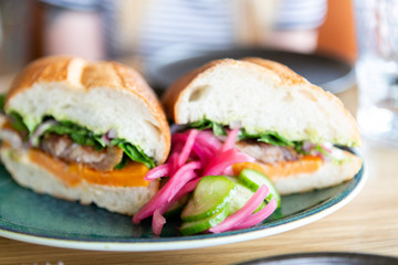 close up of mexican torta sandwich on table at restaurant