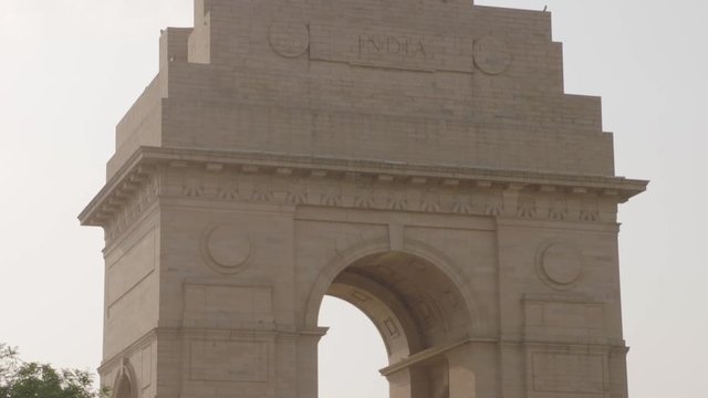 A closeup shot with downward tilting view of The India Gate, originally called the All India War Memorial, located astride the Rajpath, New Delhi, India.