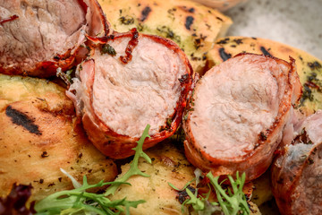 Grilled meat skewers on a wooden background