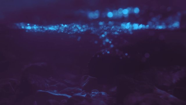 Underwater river with purple tint, background
