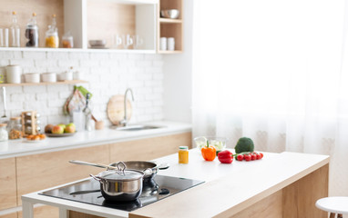Modern kitchen interior at home with cooking dishes