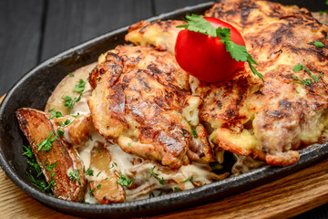 Fish dish - fried fish fillet with fried potatoes and vegetables