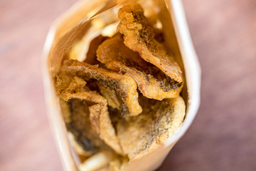 Fried Trichogaster pectoralis cut in slice fry for crispy on wooden background, Salid fish thai food