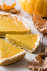 Pumpkin pie on wooden table