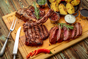 Grilled meat, porkchop with potatoes in pan