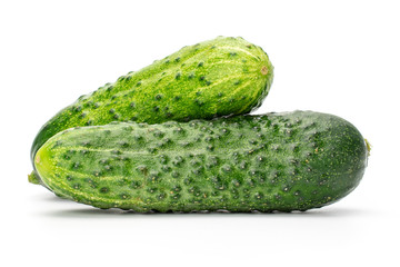 Group of two whole fresh green pickling cucumber with pimples isolated on white background