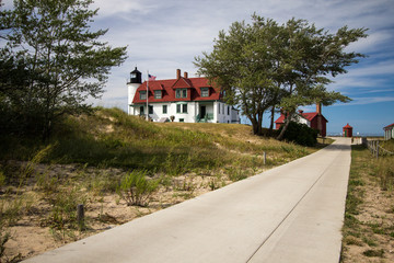 Fototapeta na wymiar The exterior of the historical Point Betsie Lighthouse in Sleeping Dunes National Lakeshore in Michigan.